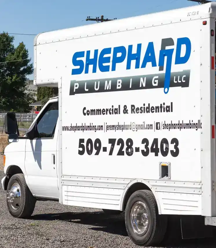 Side of a Shephard box truck lettered Commercial and Residential with the shop phone number