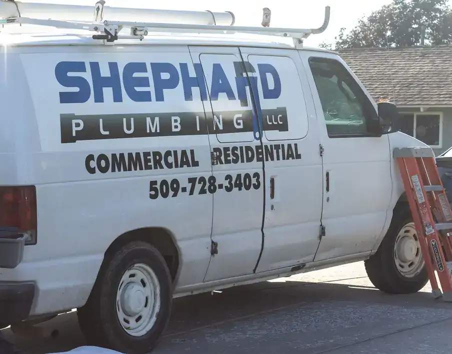 Lettered Shephard Ford van parked at a jobsite